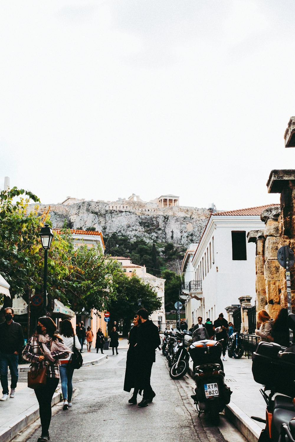 a group of people walking down a street