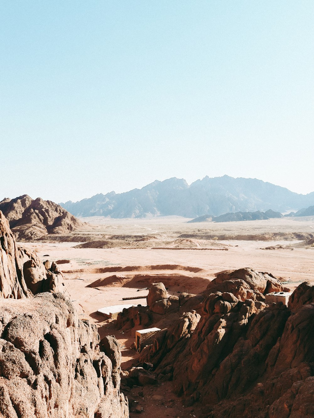 a man standing on top of a rock formation