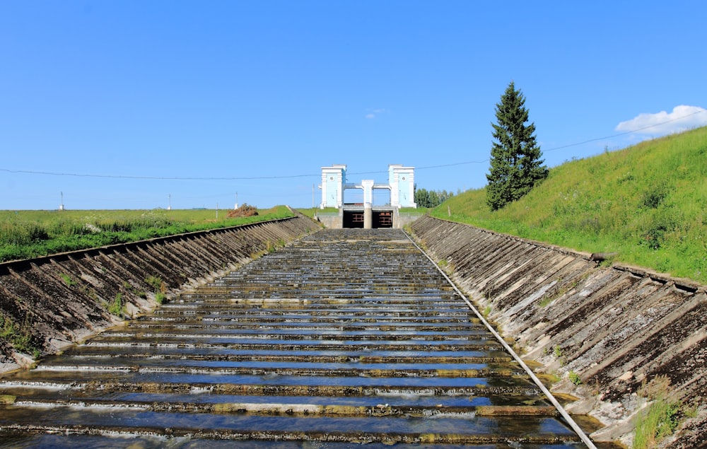 a train track with water coming out of it