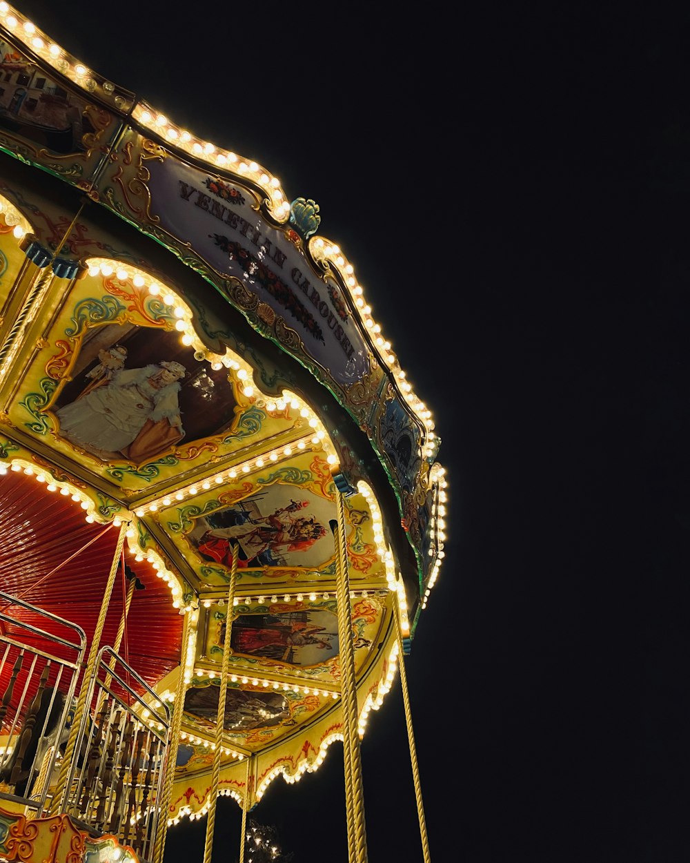 a merry go round at night with lights on