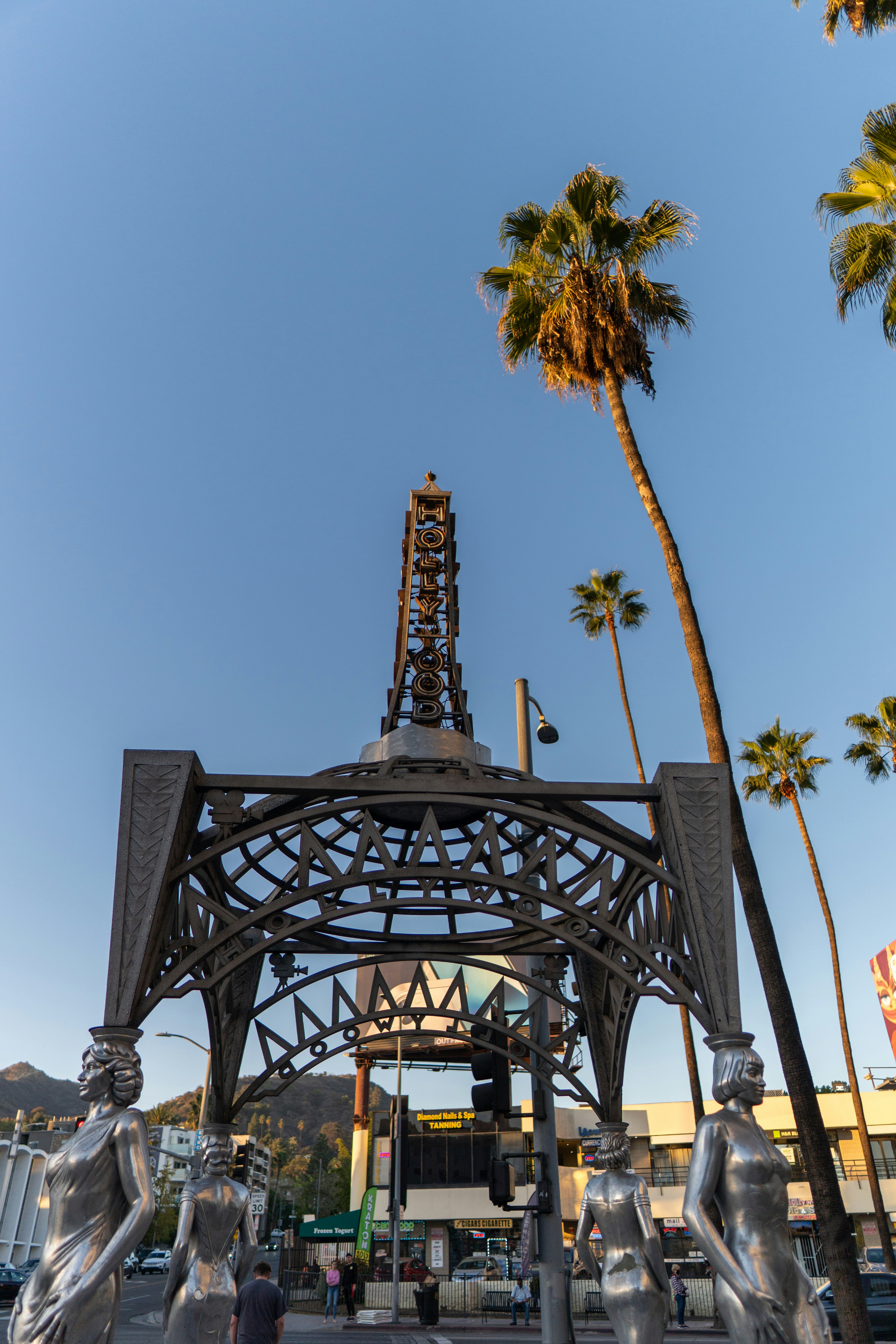 a metal structure with a clock on top of it