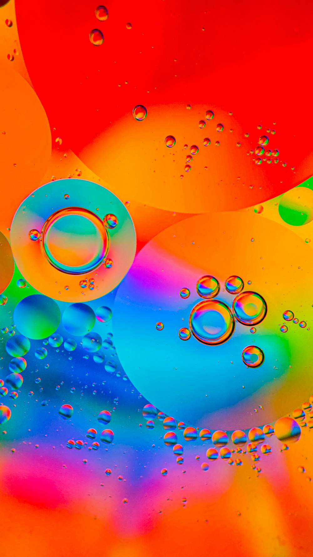 a multicolored background with bubbles of water