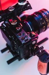 a close up of a camera with a wooden handle