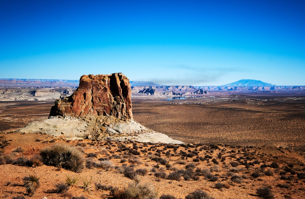 a rocky outcropping in the middle of a desert