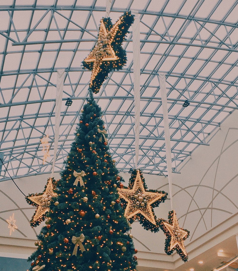 a decorated christmas tree in a shopping mall
