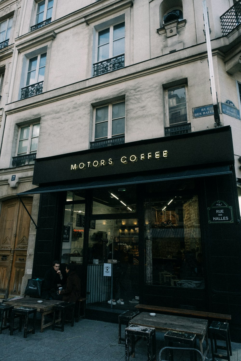 a coffee shop on the corner of a street