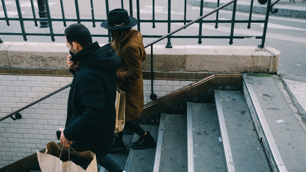 two people walking up a flight of stairs