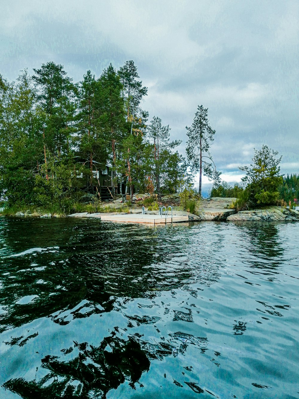 a body of water with a small island in the background