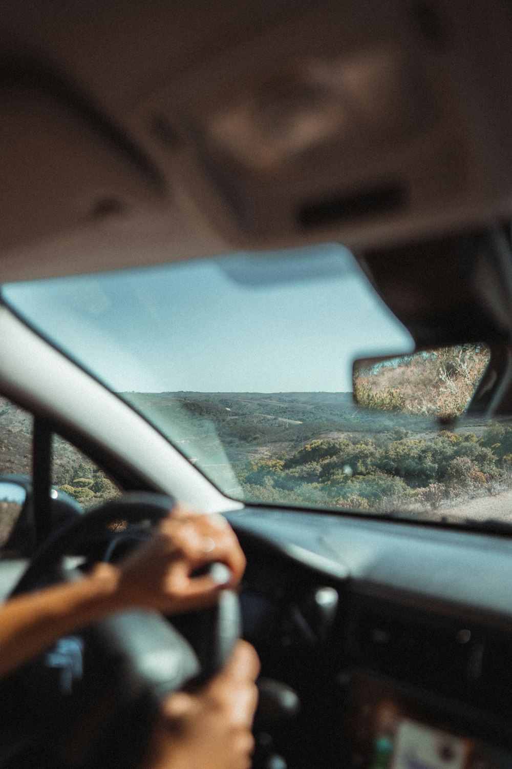 a person driving a car on a road