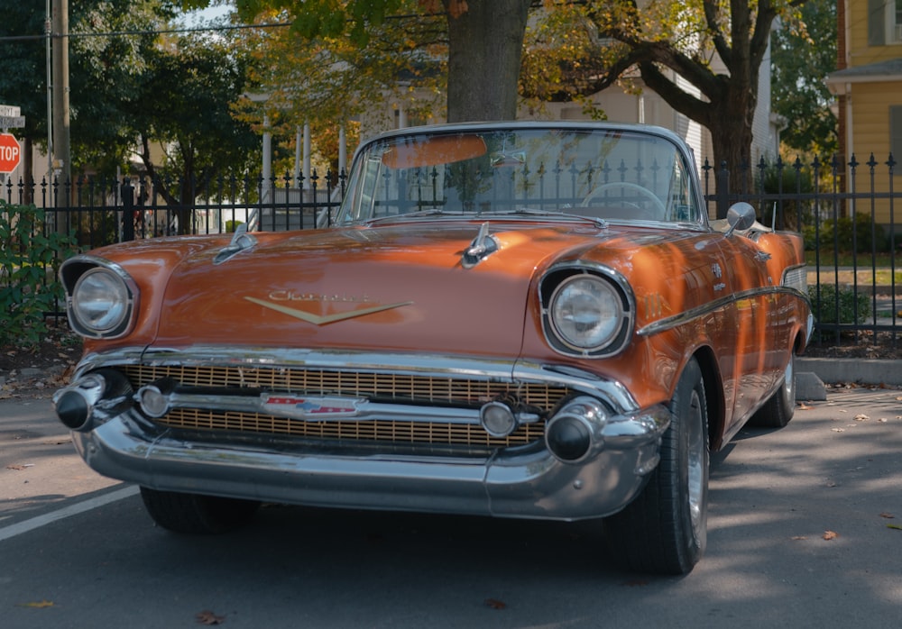 an old car parked on the side of the road