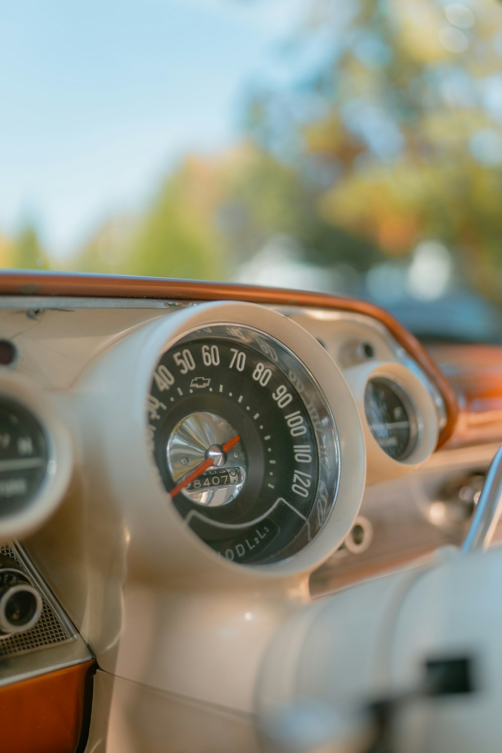 a car dashboard with a speedometer and gauges