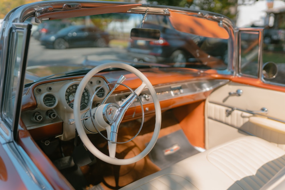 the interior of a car with a steering wheel and dashboard