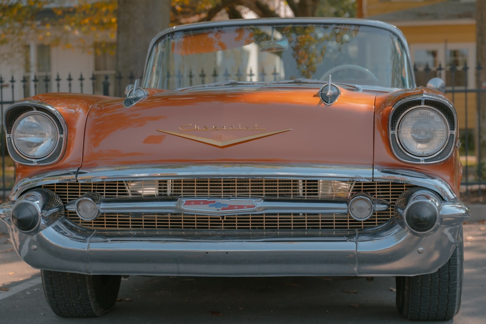 a classic car parked on the side of the road