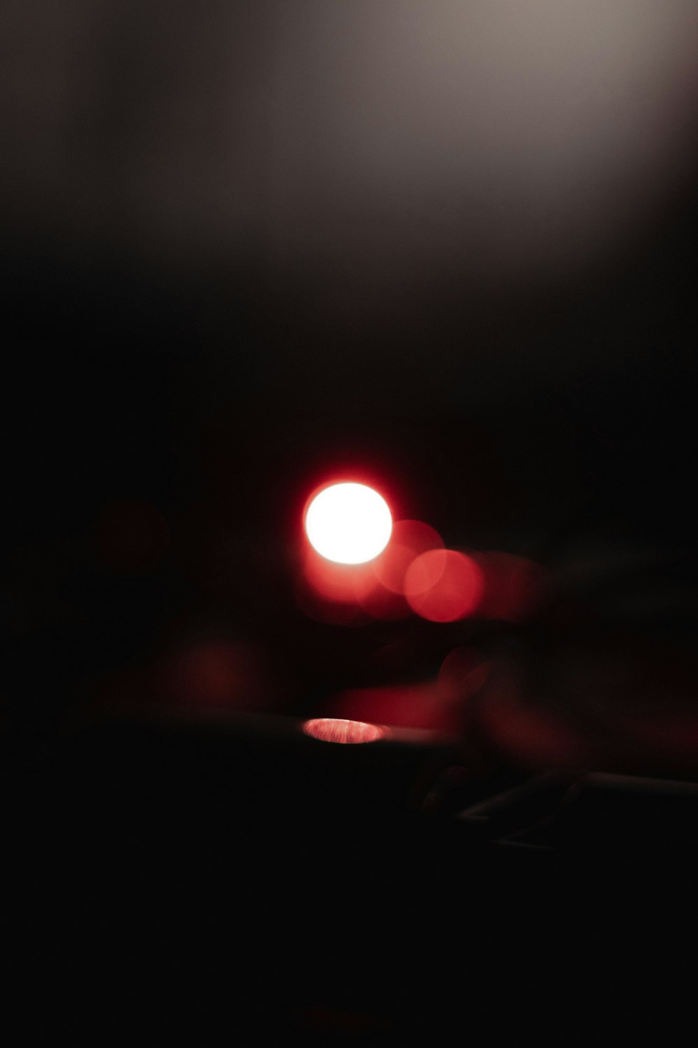 a blurry photo of a red light in the dark