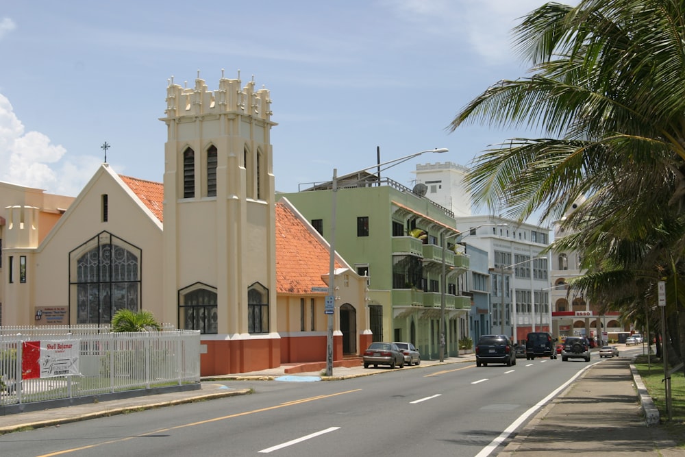 a street lined with buildings and palm trees