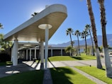 a building with palm trees in front of it