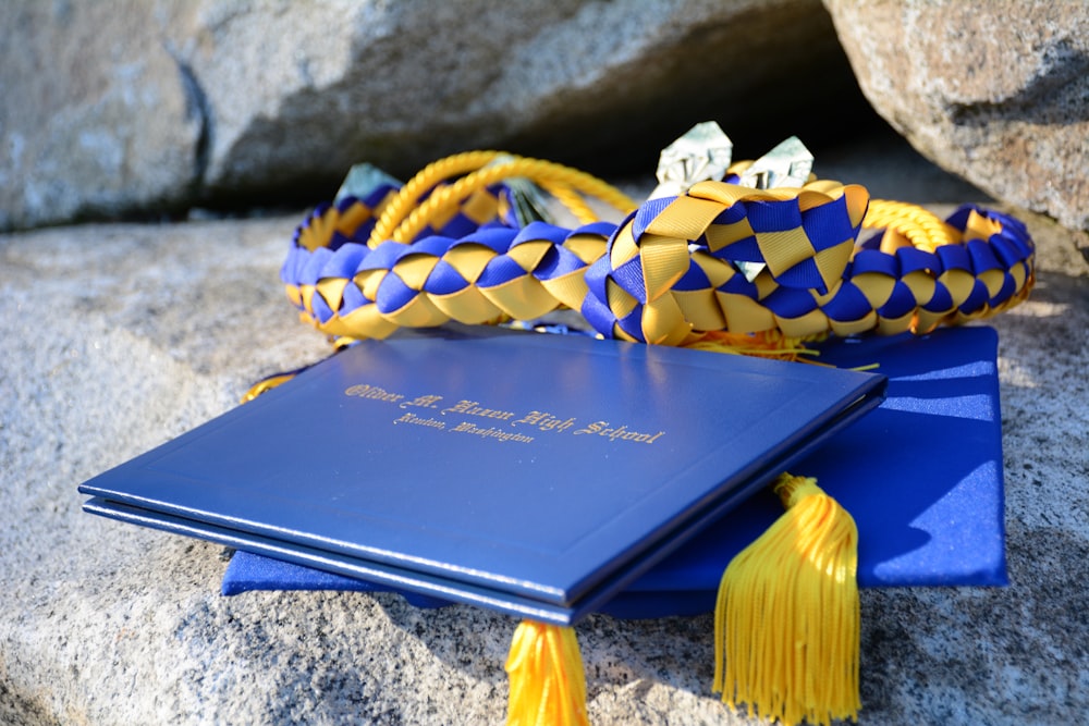 a blue book with a yellow tassel on top of it