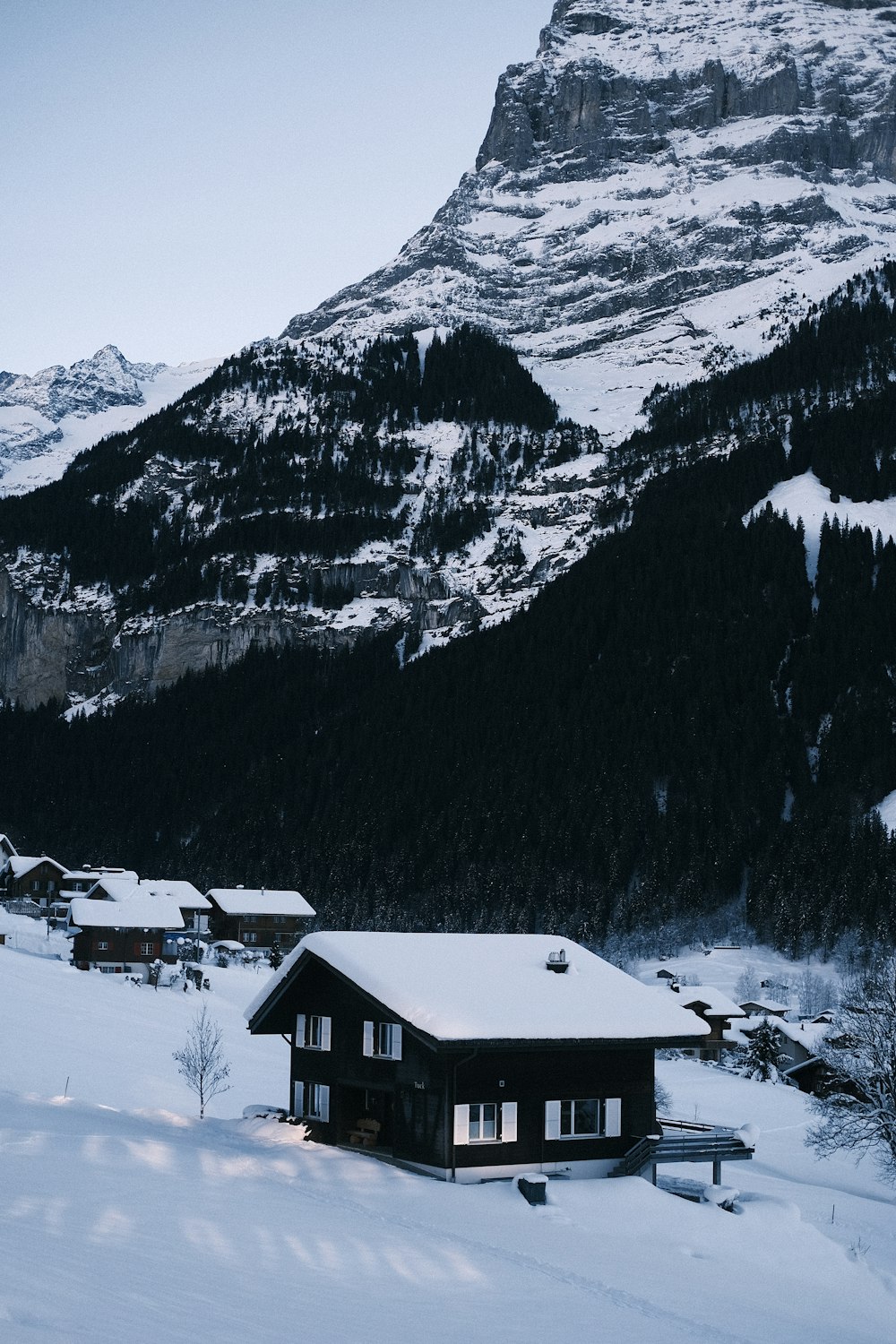 a cabin in the middle of a snowy mountain