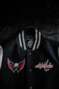 Close-up of a vibrant varsity jacket with embroidered logo