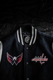 A vibrant custom sports jacket featuring bold colors and personalized logos.