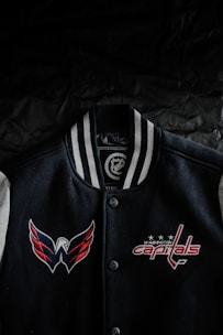 A vibrant custom sports jacket featuring bold colors and personalized logos.