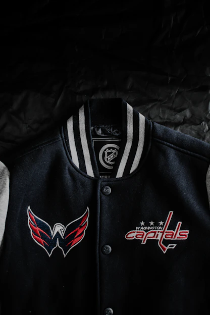 A vibrant varsity jacket styled with bold colors and spirit-themed patches.