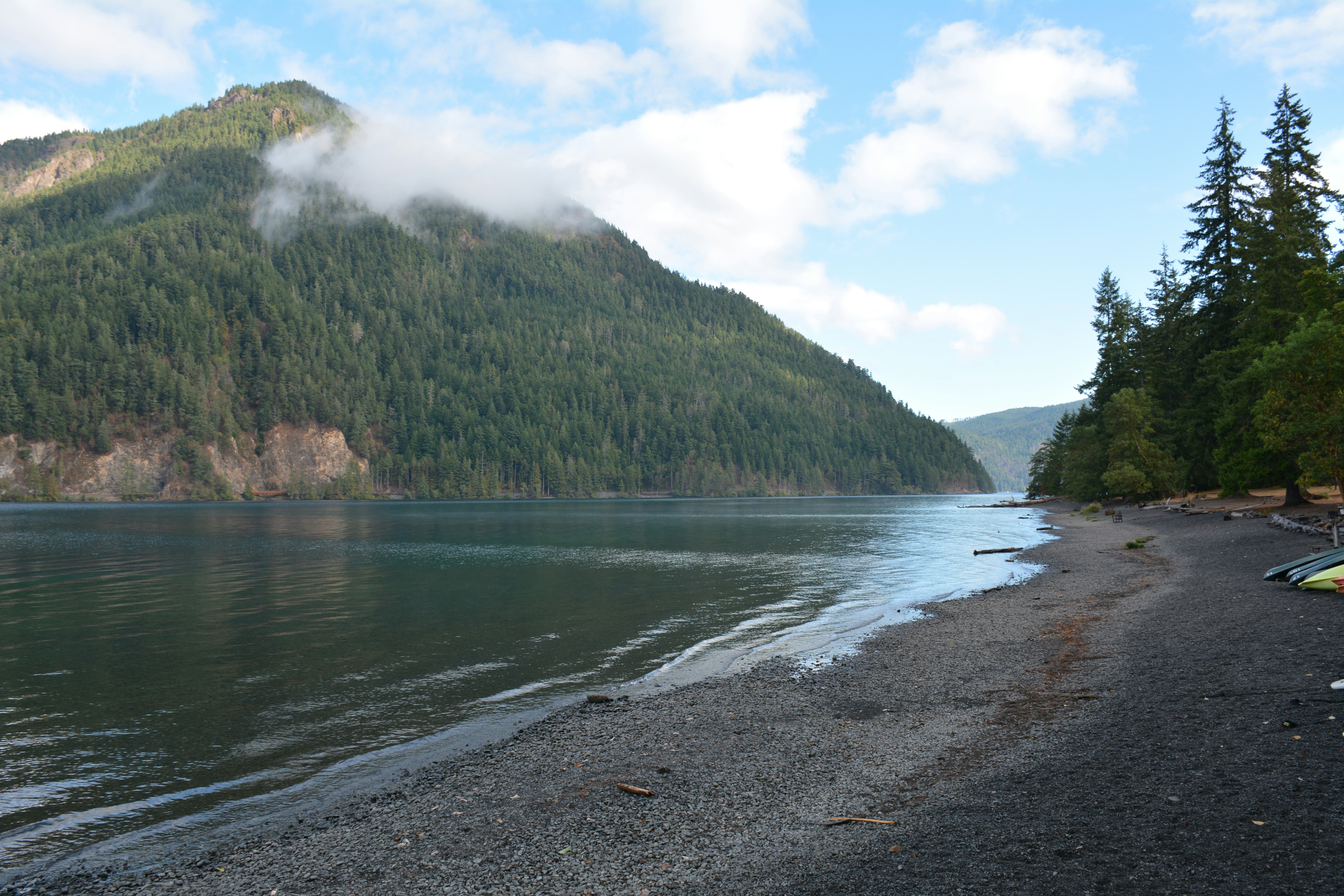 a body of water with a mountain in the background