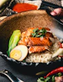 a close up of a bowl of food on a table