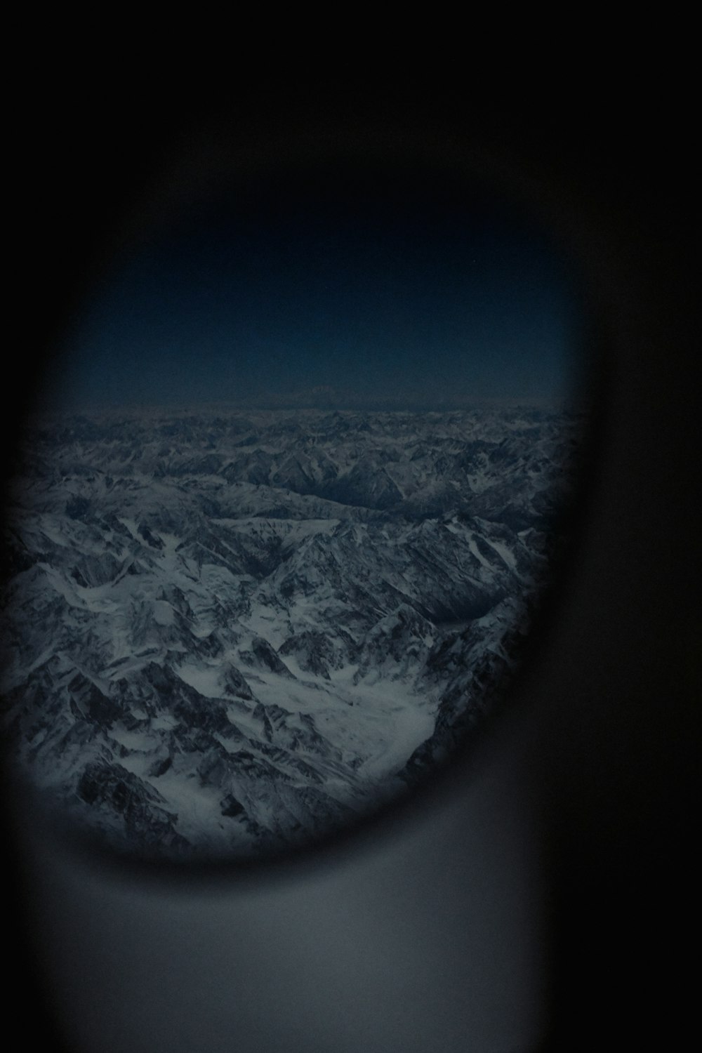 a view of a mountain range from an airplane window