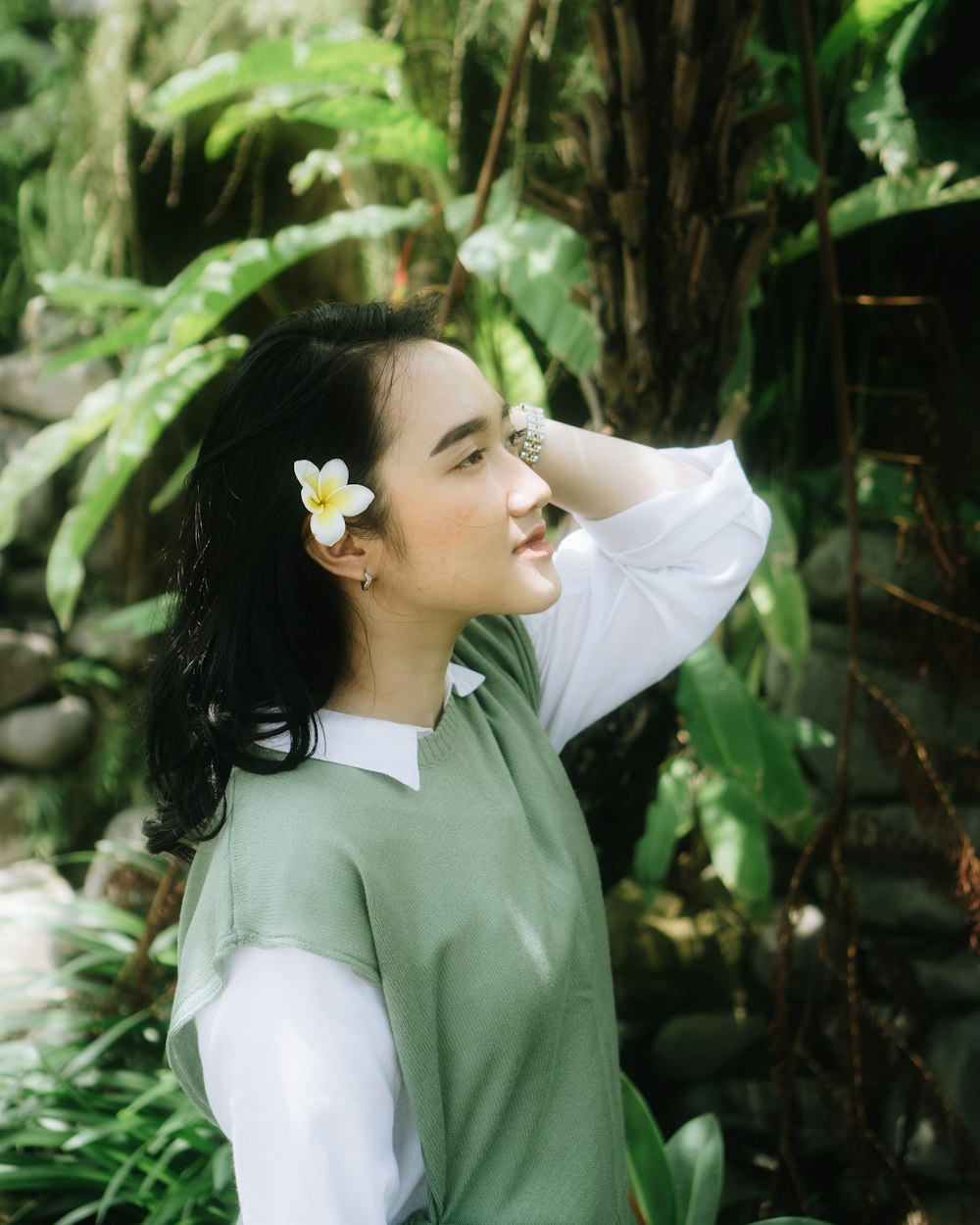 a woman with a flower in her hair