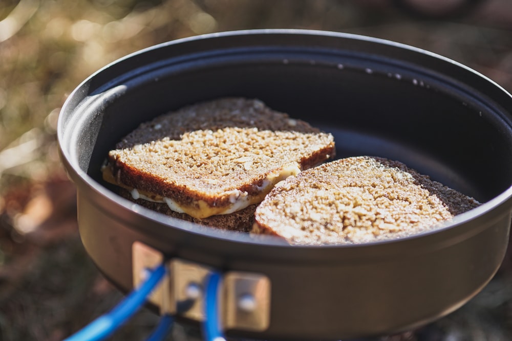 two pieces of bread sitting in a pot