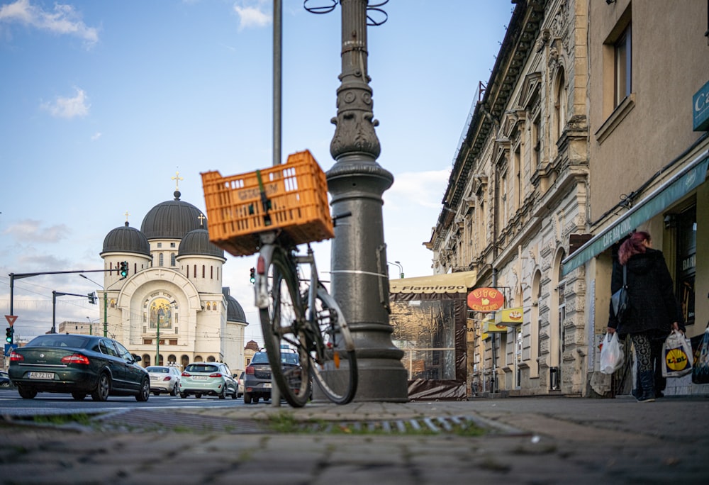 a bicycle parked on the side of a street