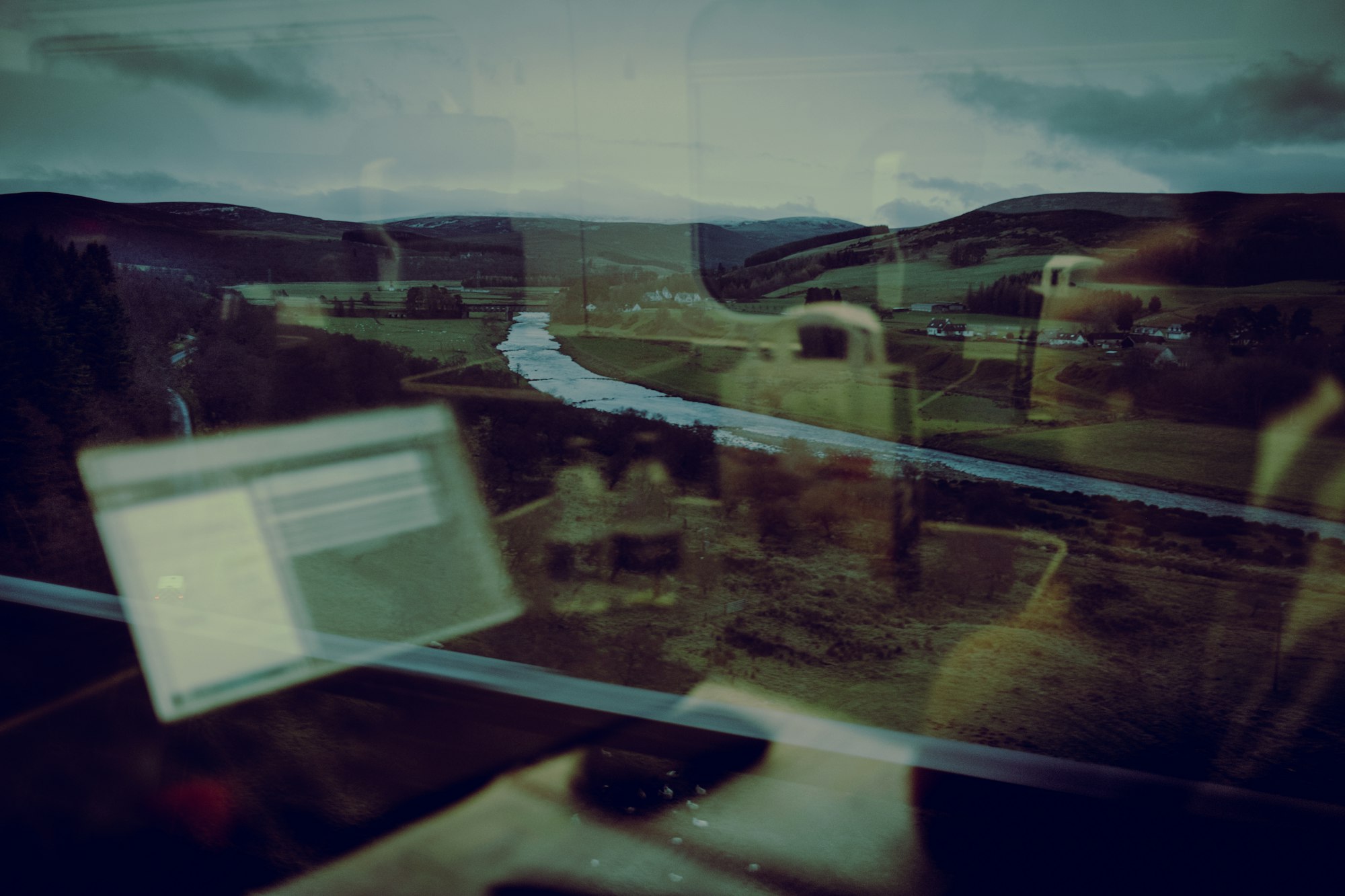 Trying to work on the train heading south through astonishing Highland scenery (can you spot the water bottles and geese?)