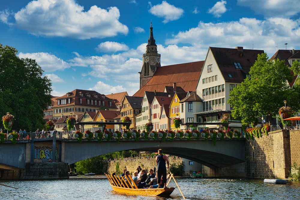 a group of people riding on top of a boat on a river