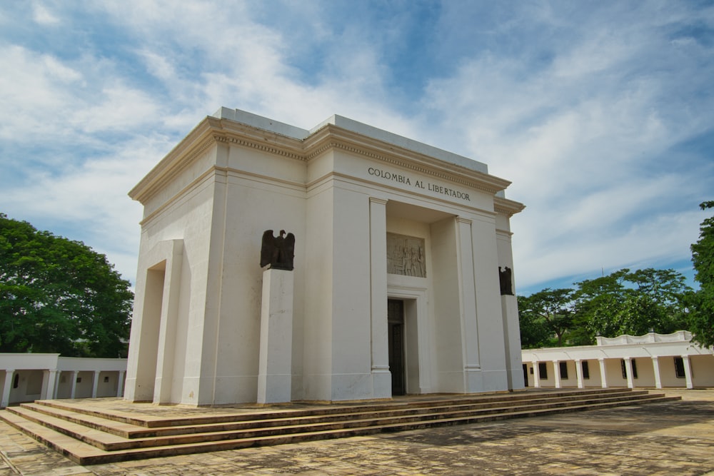 a white building with steps leading up to it