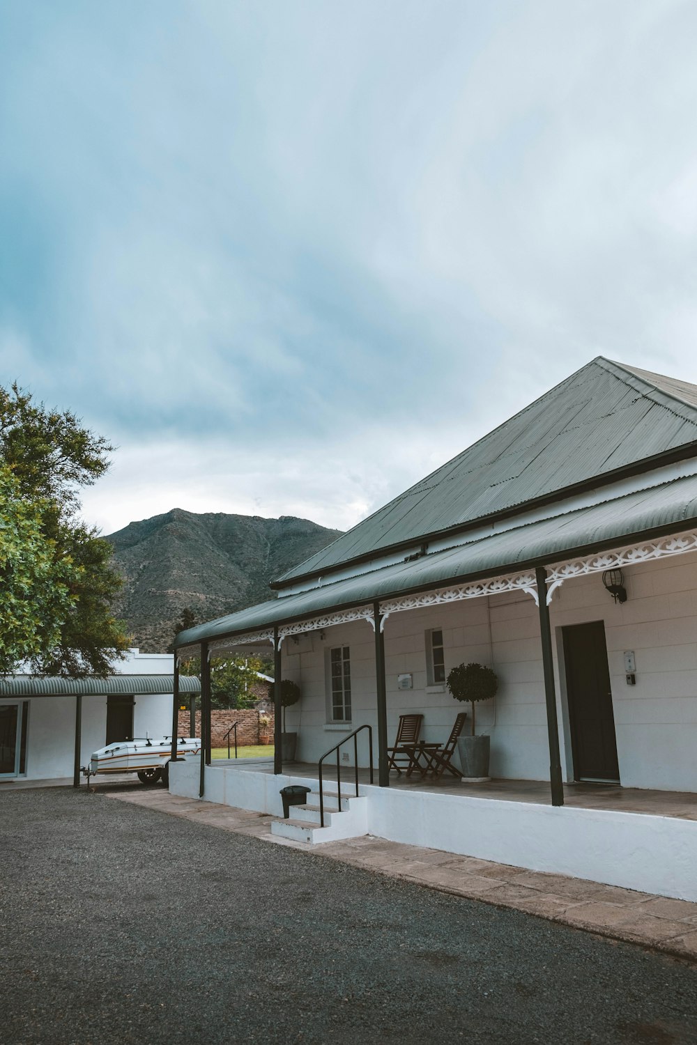 a white house with a porch and a covered porch