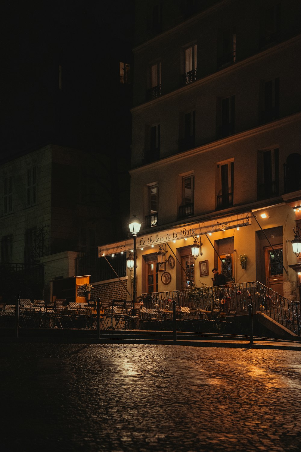 a building lit up at night with street lights