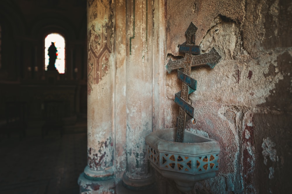 a cross on a wall in a church