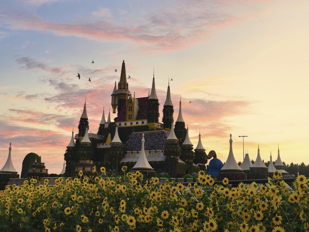 Un campo de girasoles con un castillo al fondo