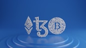 Symbols of Ethereum, Tezos, and Bitcoin are depicted using small white spheres on a blue, tiered platform, creating a modern and digital aesthetic.