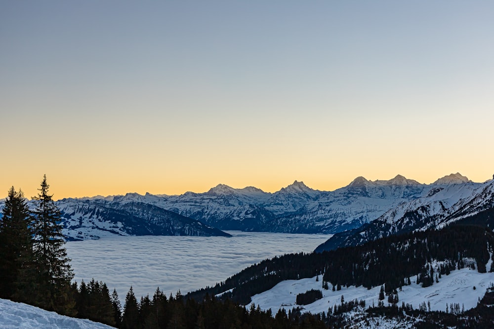 a view of a mountain range covered in snow