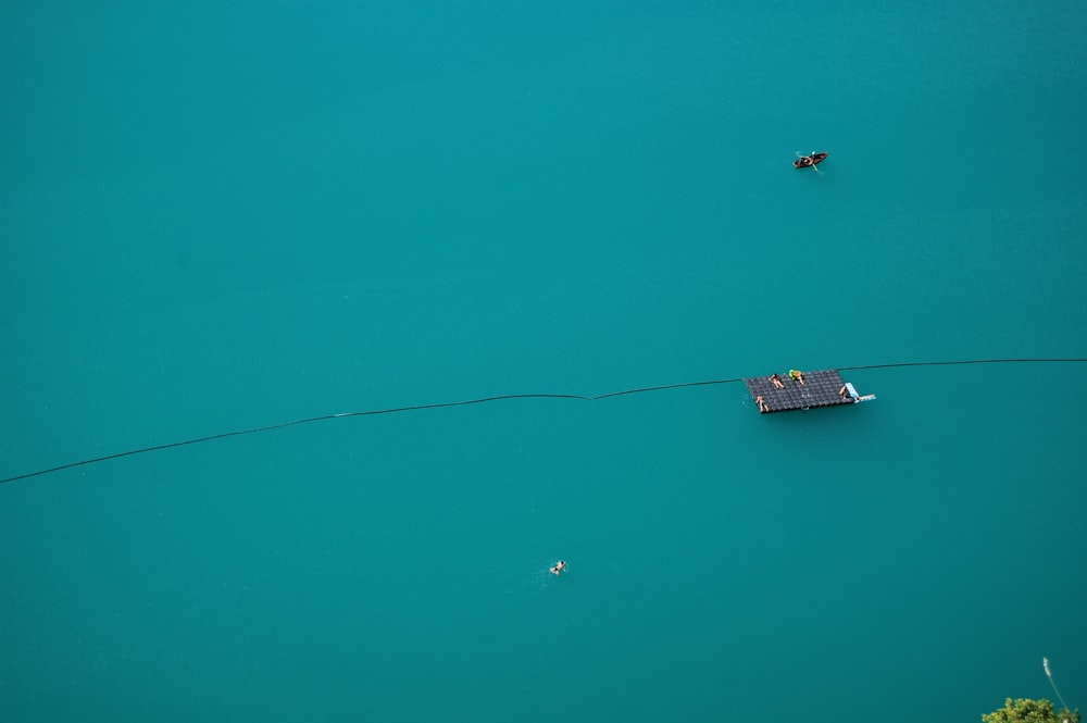 a boat floating on top of a large body of water