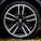 Close-up of a Porsche GT3 wheel fitted with 9rs forged alloy rims on a racetrack.