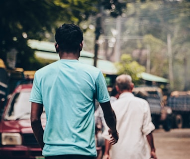 a couple of men walking down a street