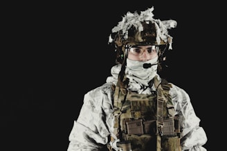 a man wearing a camouflage uniform and a helmet
