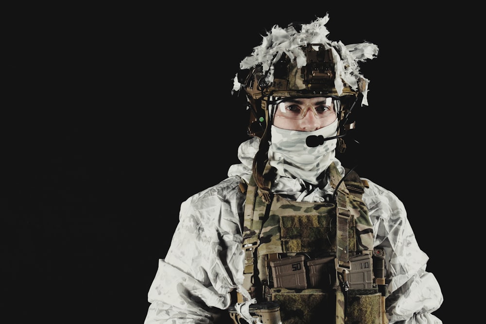 a man wearing a camouflage uniform and a helmet