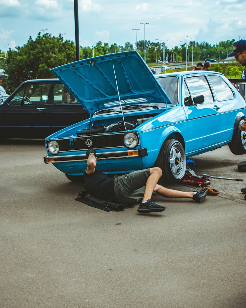 Technician working under a car