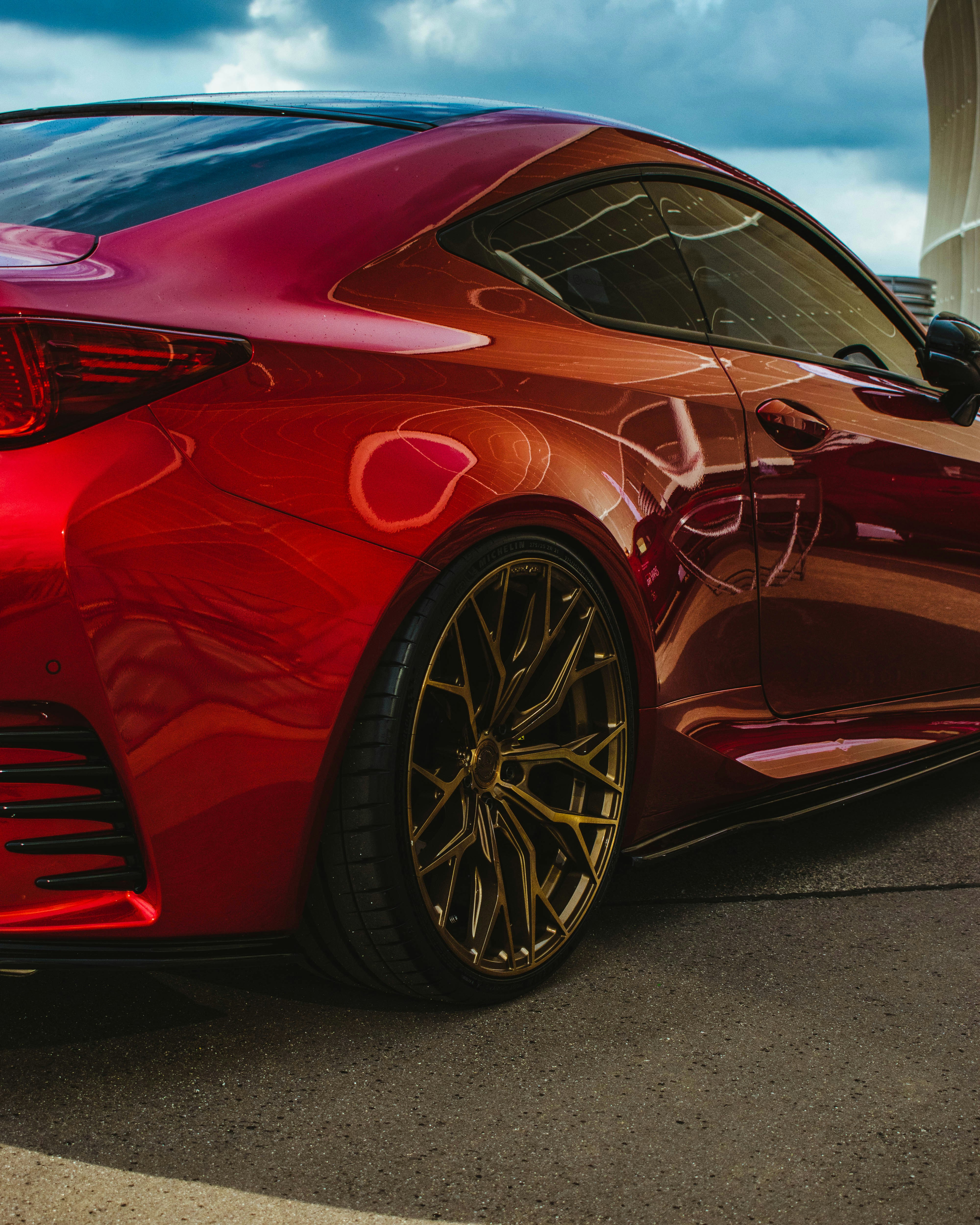 a red sports car parked in a parking lot