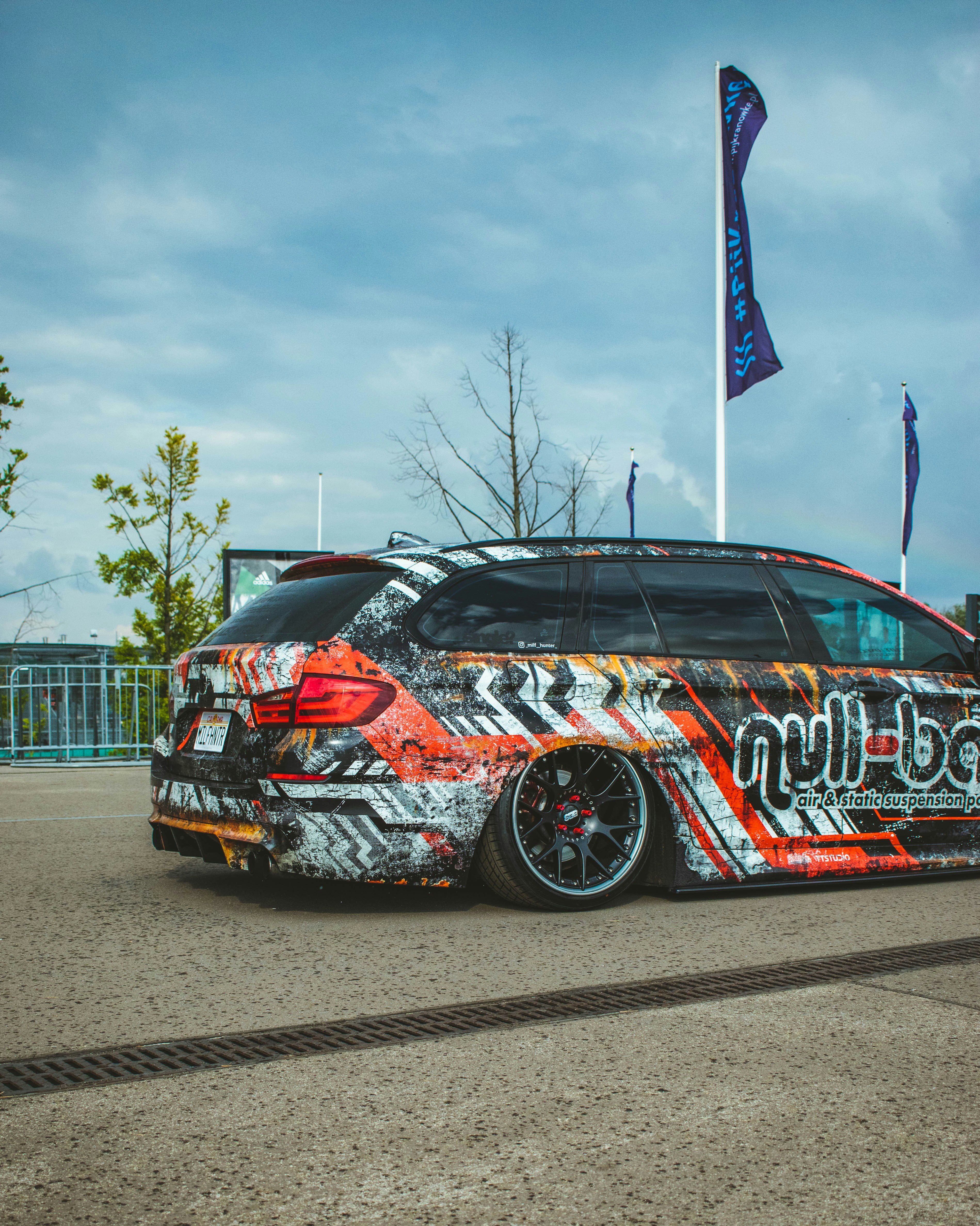 a car that has been painted to look like it is parked in a parking lot