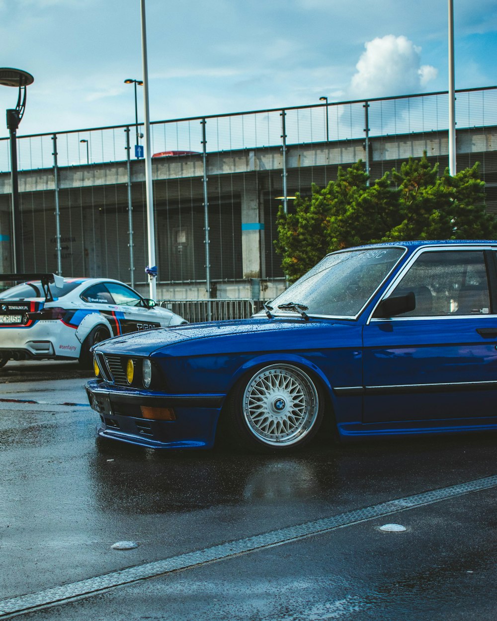 a blue car parked on the side of the road